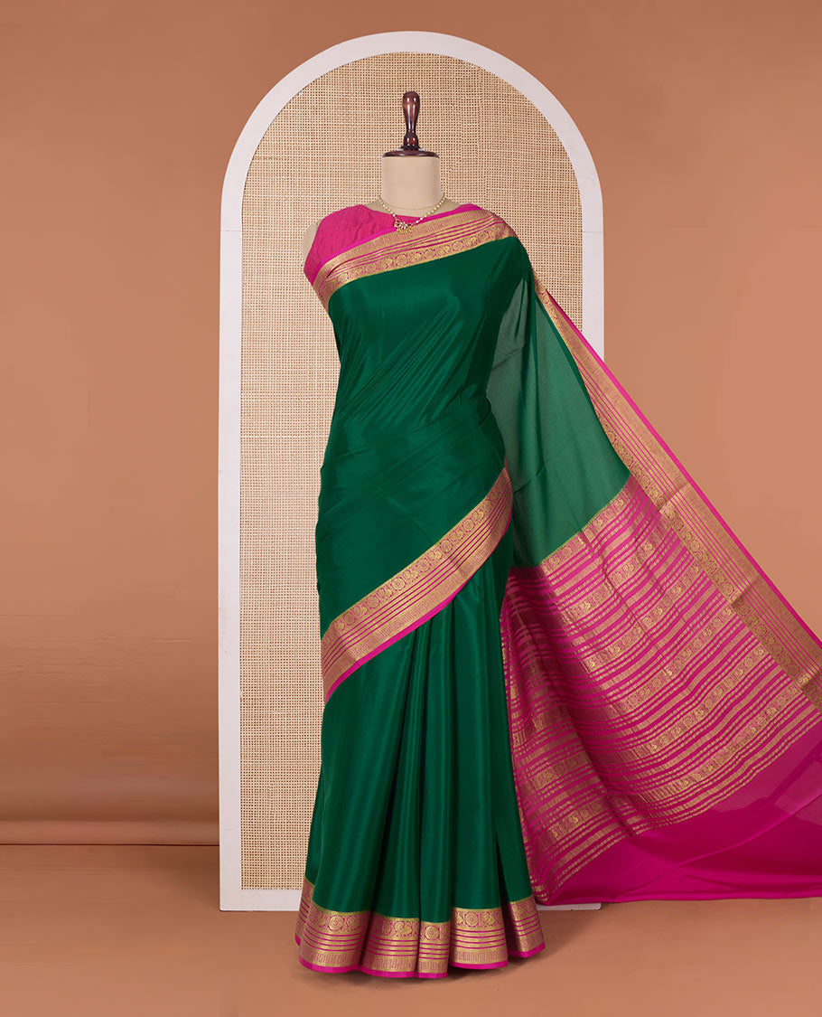 Green plain Mysore silk saree, contrast Peacock and chakram border, and pallu of traditional zari designs