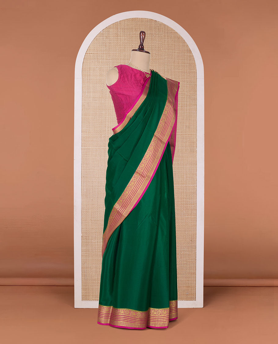 Green plain Mysore silk saree, contrast Peacock and chakram border, and pallu of traditional zari designs