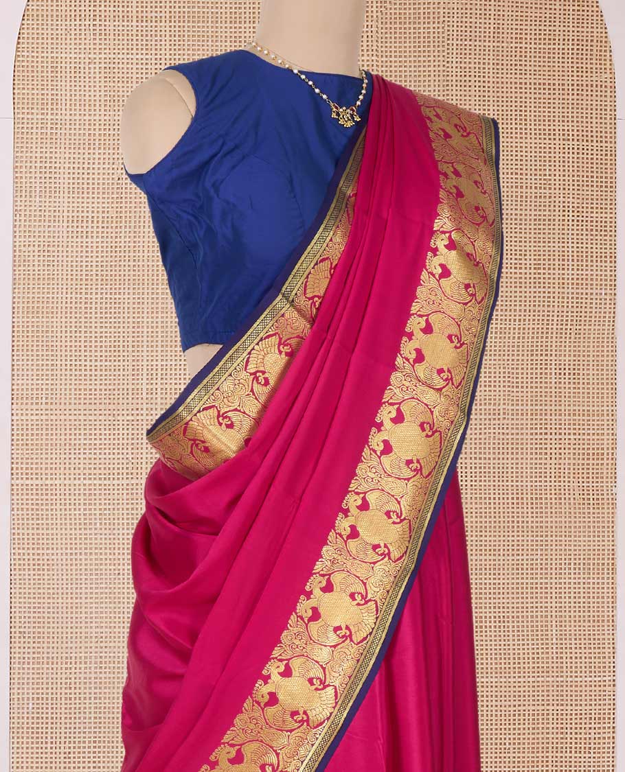 Pink plain Mysore silk saree, two-headed eagle zari border, and pallu steeped with two-headed eagle motifs