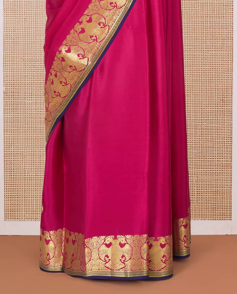 Pink plain Mysore silk saree, two-headed eagle zari border, and pallu steeped with two-headed eagle motifs