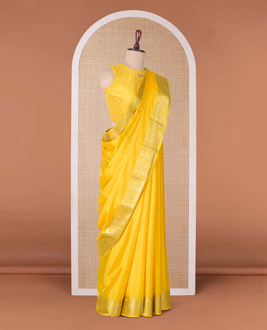 Yellow plain Mysore silk saree, two-headed eagle zari border, and pallu steeped with two-headed eagle motifs
