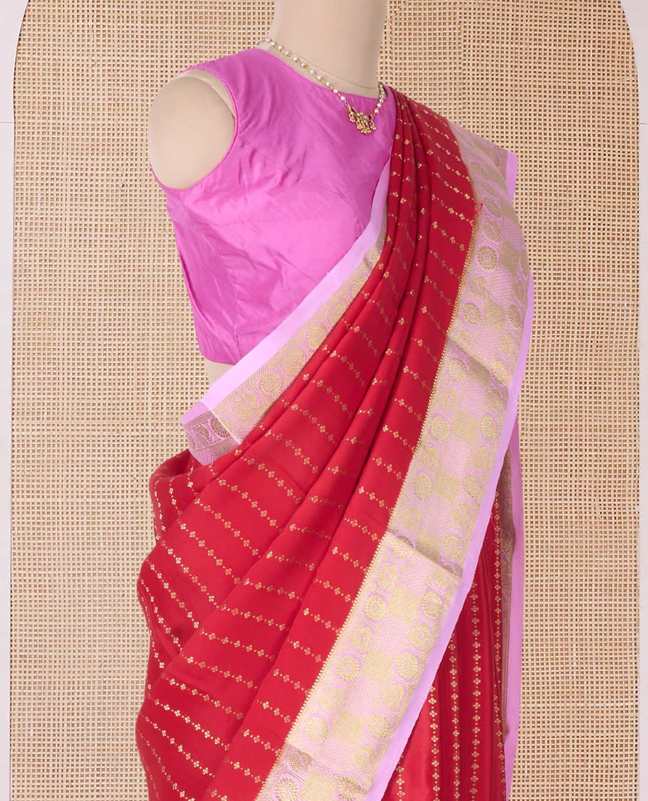 Red zari buttas Mysore silk saree, contrast peacock chakra motifs border, and traditional zari design pallu