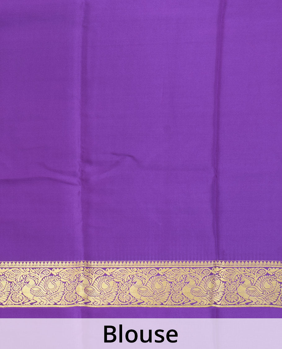 Purple embossed Mysore silk saree, traditional peacock motifs zari woven border, and pallu of traditional designs