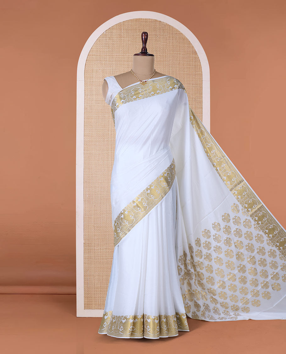 White plain Mysore silk saree, two-headed eagle zari border, and pallu steeped with two-headed eagle motifs