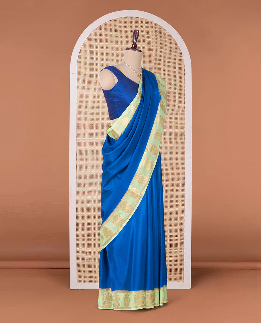 Blue plain Mysore silk saree, contrast two-headed eagle motifs zari woven border, and intricate pallu