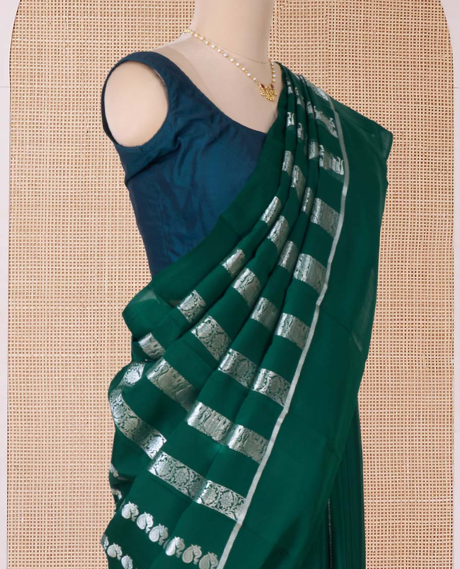 Green peacock, elephant, and floral creeper striped Mysore silk saree, self-border, and pallu of kanchipuram inspired flora-fauna designs