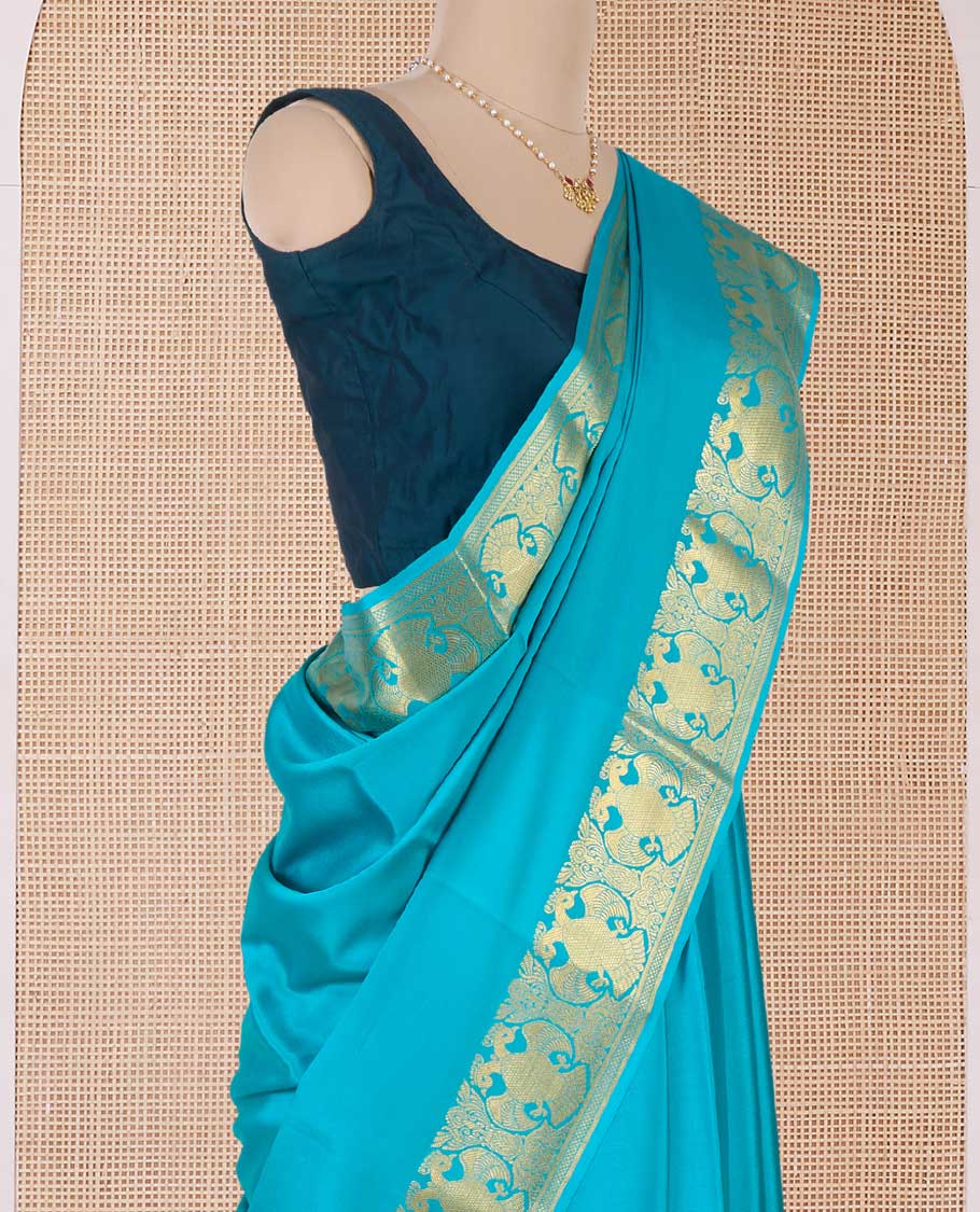Blue plain Mysore silk saree, two-headed eagle motifs zari border, and pallu