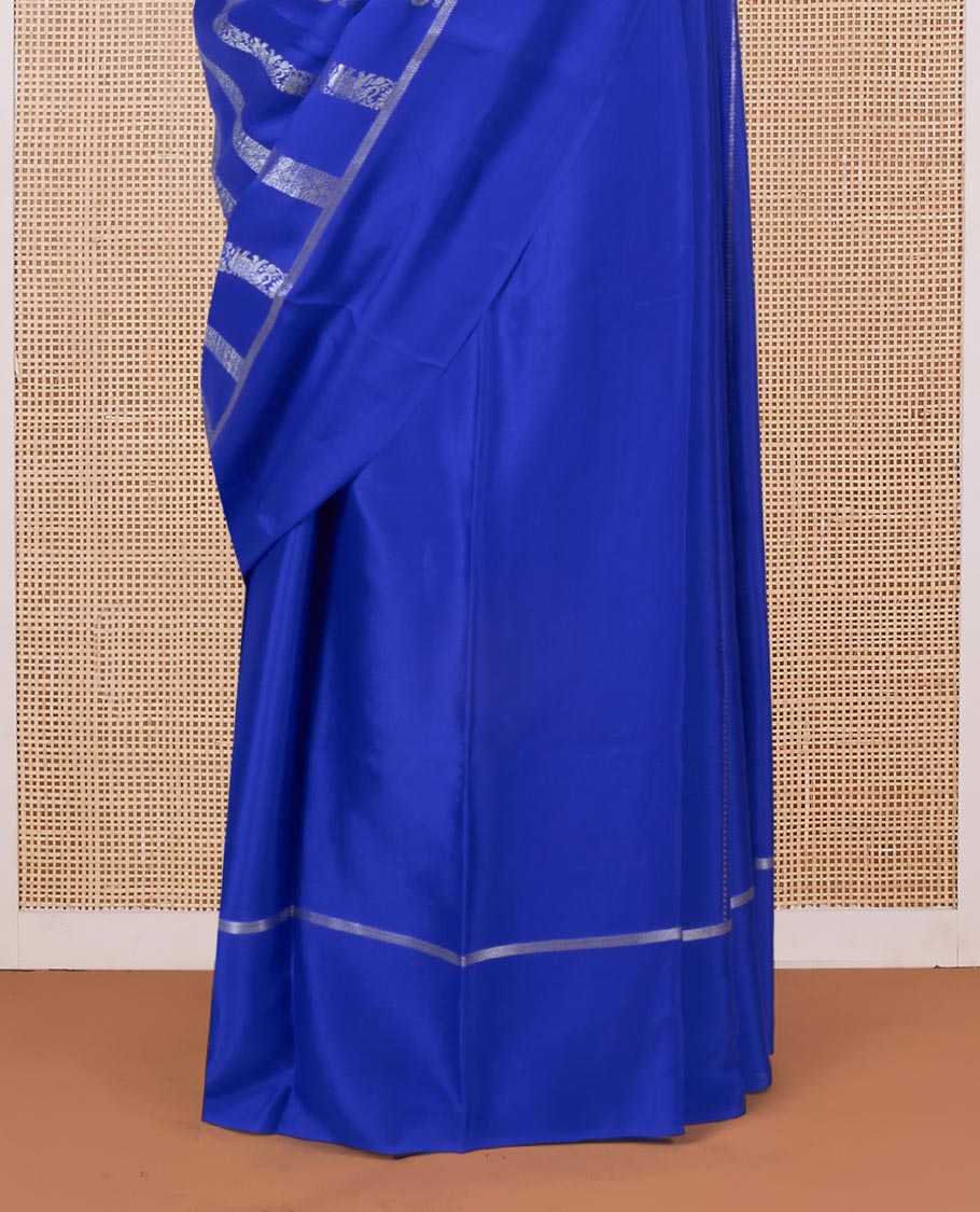 Blue floral creeper, peacock, elephant motifs woven Mysore silk saree, self-border, and traditional zari pallu