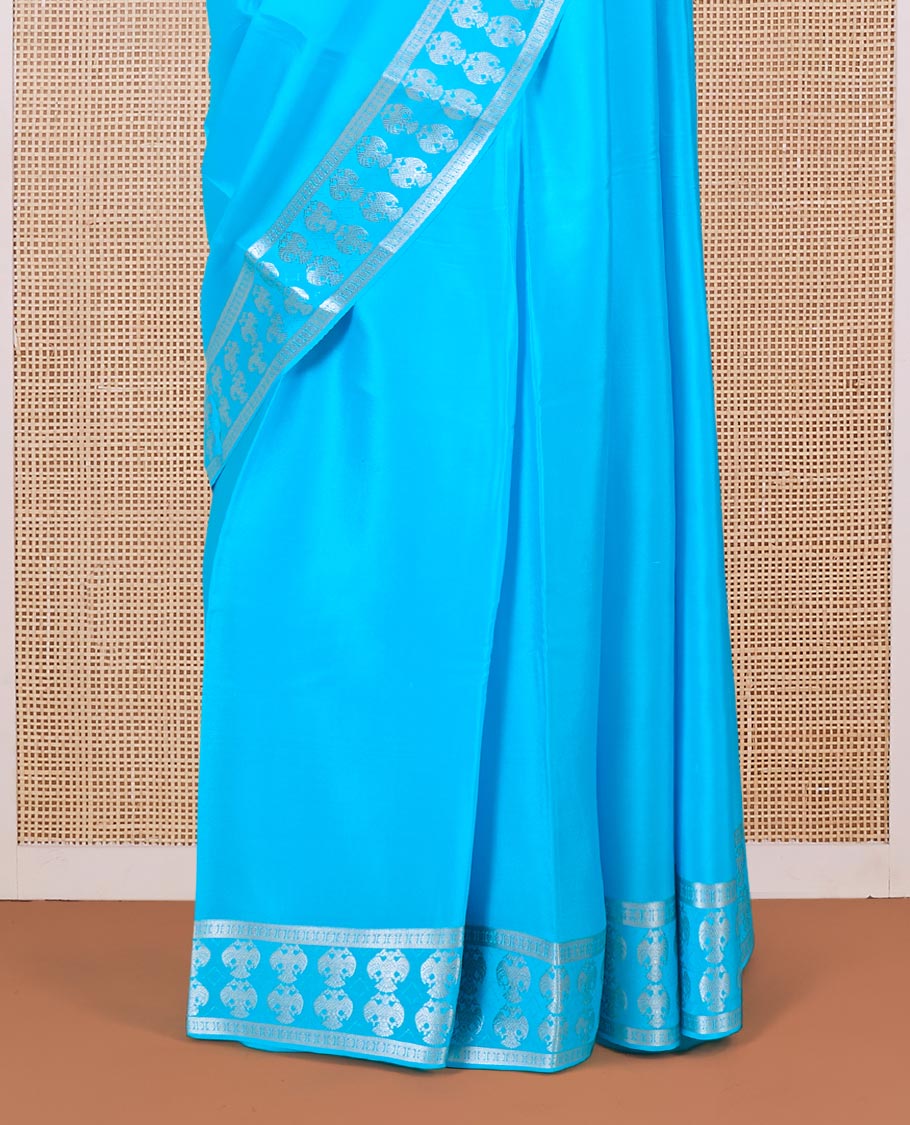 Blue plain Mysore silk saree, two-headed eagle zari woven border, and pallu of two-headed eagle motifs