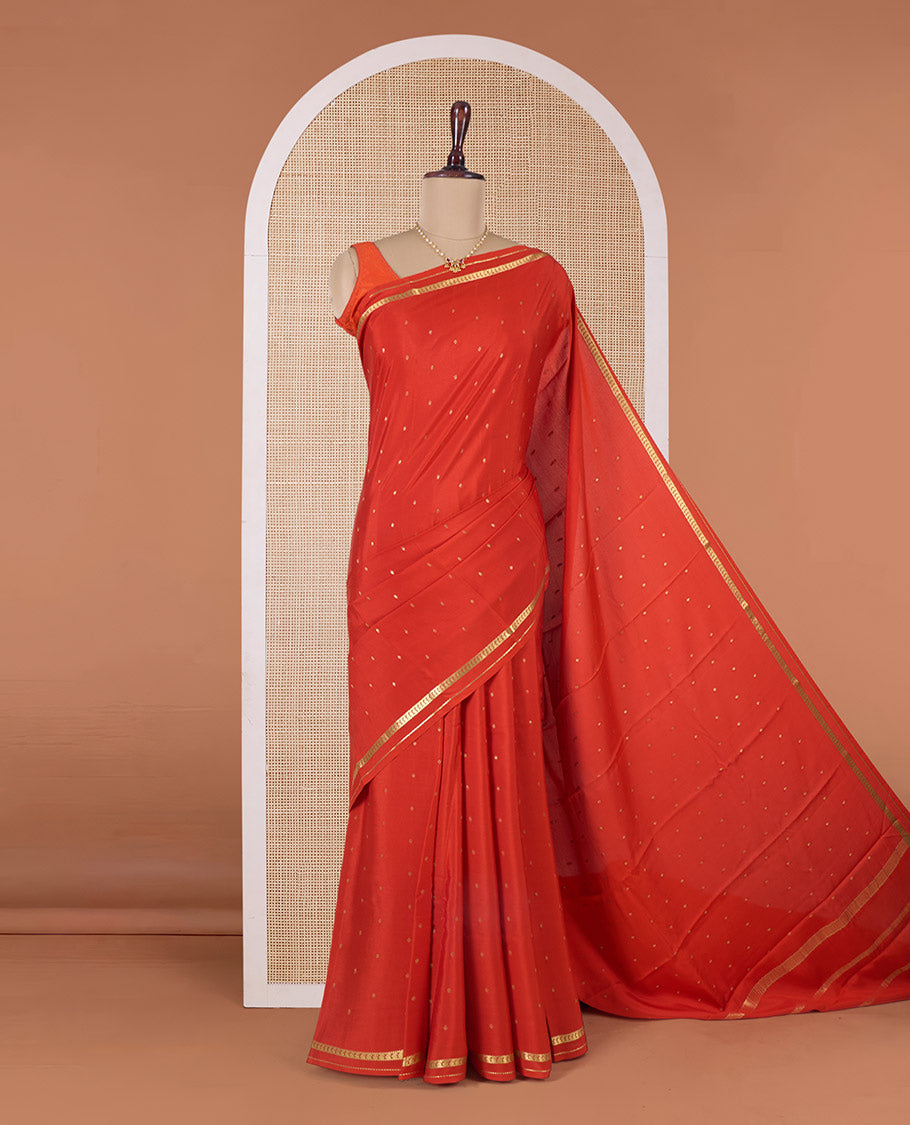 Orange zari buttas Mysore silk saree, paisley motifs border, and pallu of zari stripes