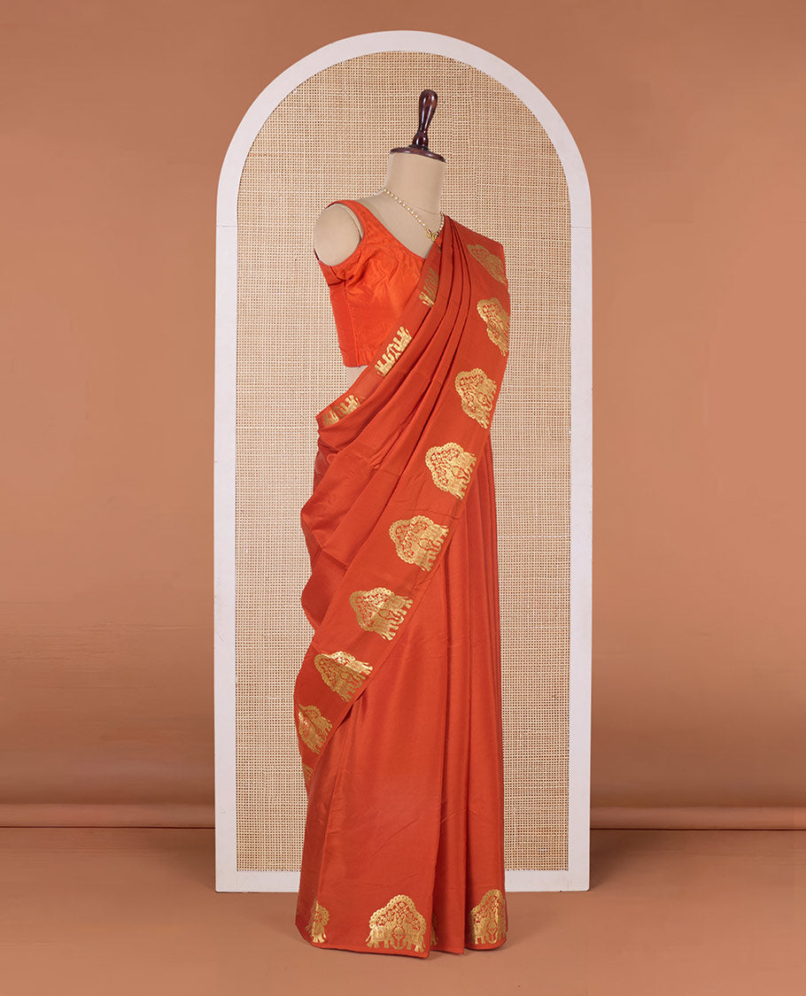 Orange plain Mysore silk saree, elephant motifs border, and pallu steeped with elephant motifs in zari