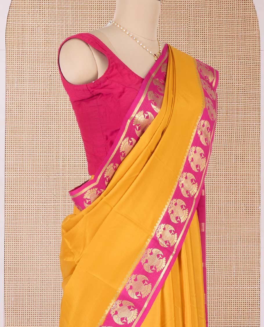 Yellow plain Mysore silk saree, contrast two-headed eagle zari border, and pallu of stripes