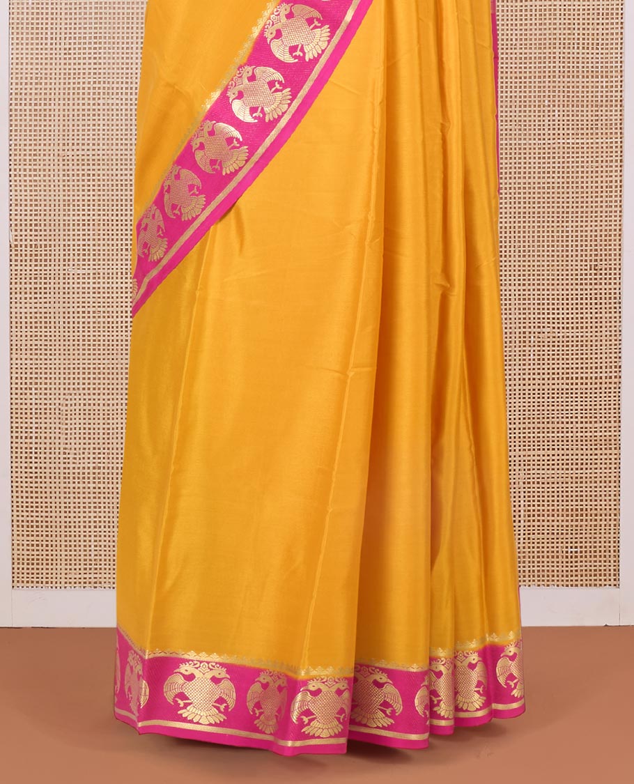 Yellow plain Mysore silk saree, contrast two-headed eagle zari border, and pallu of stripes