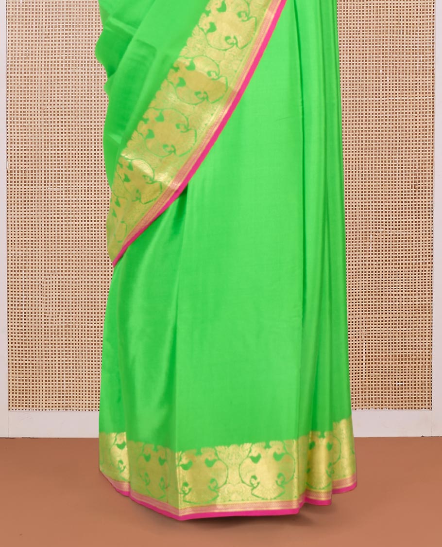 Parrot green plain Mysore silk saree, two-headed eagle zari border, and pallu steeped with two-headed eagle motifs