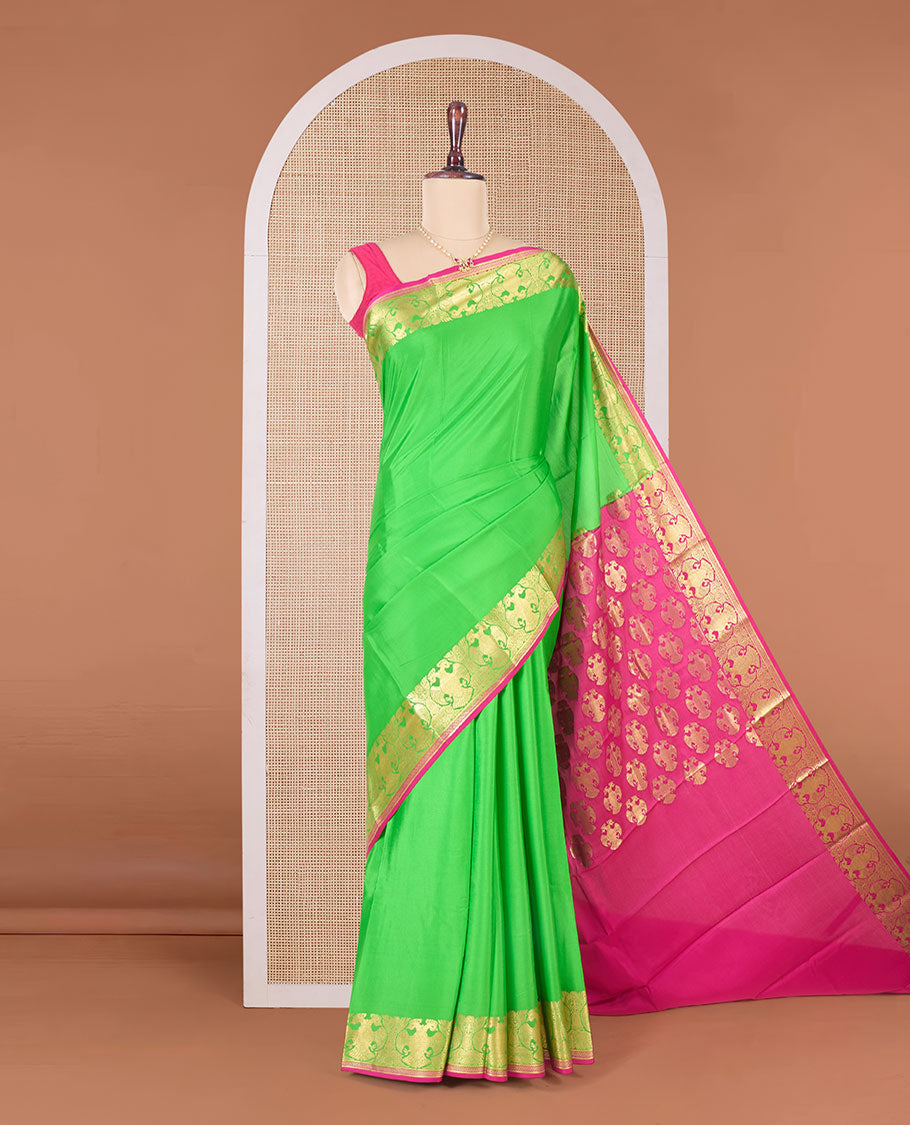 Parrot green plain Mysore silk saree, two-headed eagle zari border, and pallu steeped with two-headed eagle motifs