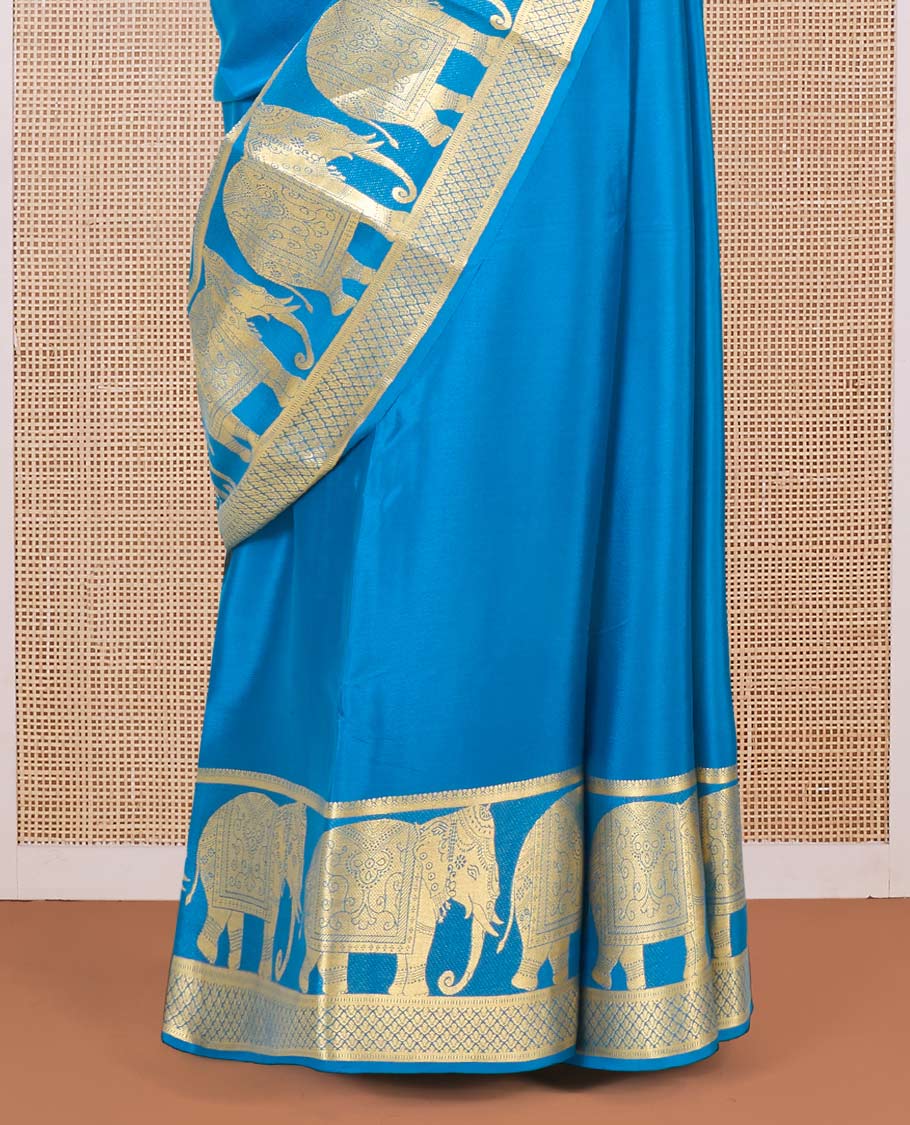 Blue plain Mysore silk saree, traditional zari border of elephant motifs in zari, and intricate pallu