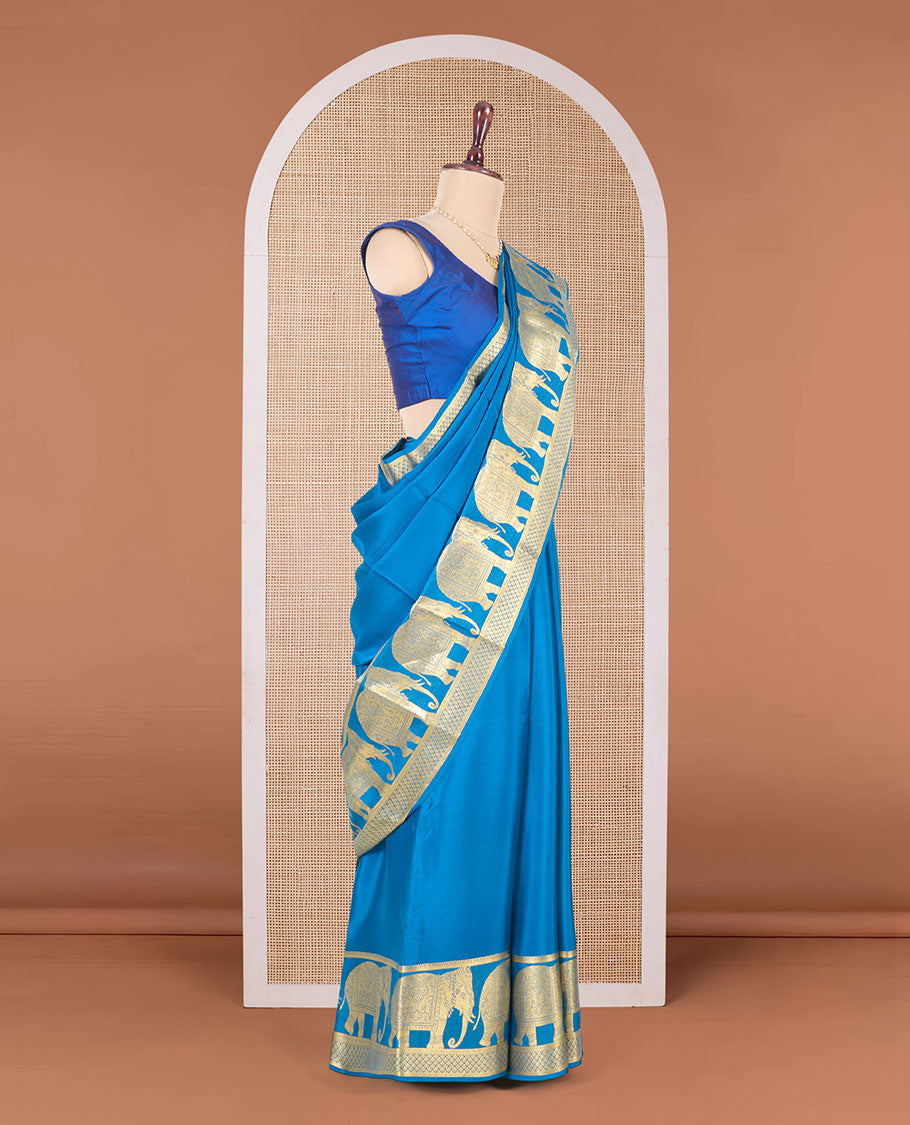 Blue plain Mysore silk saree, traditional zari border of elephant motifs in zari, and intricate pallu