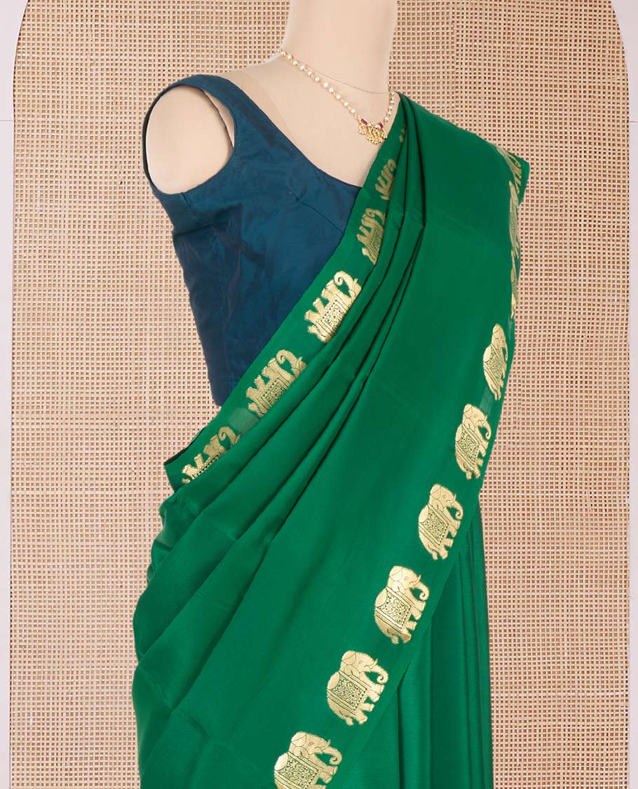 Green plain Mysore silk saree with elephant motifs zari border, and pallu of miniatures of elephant motifs