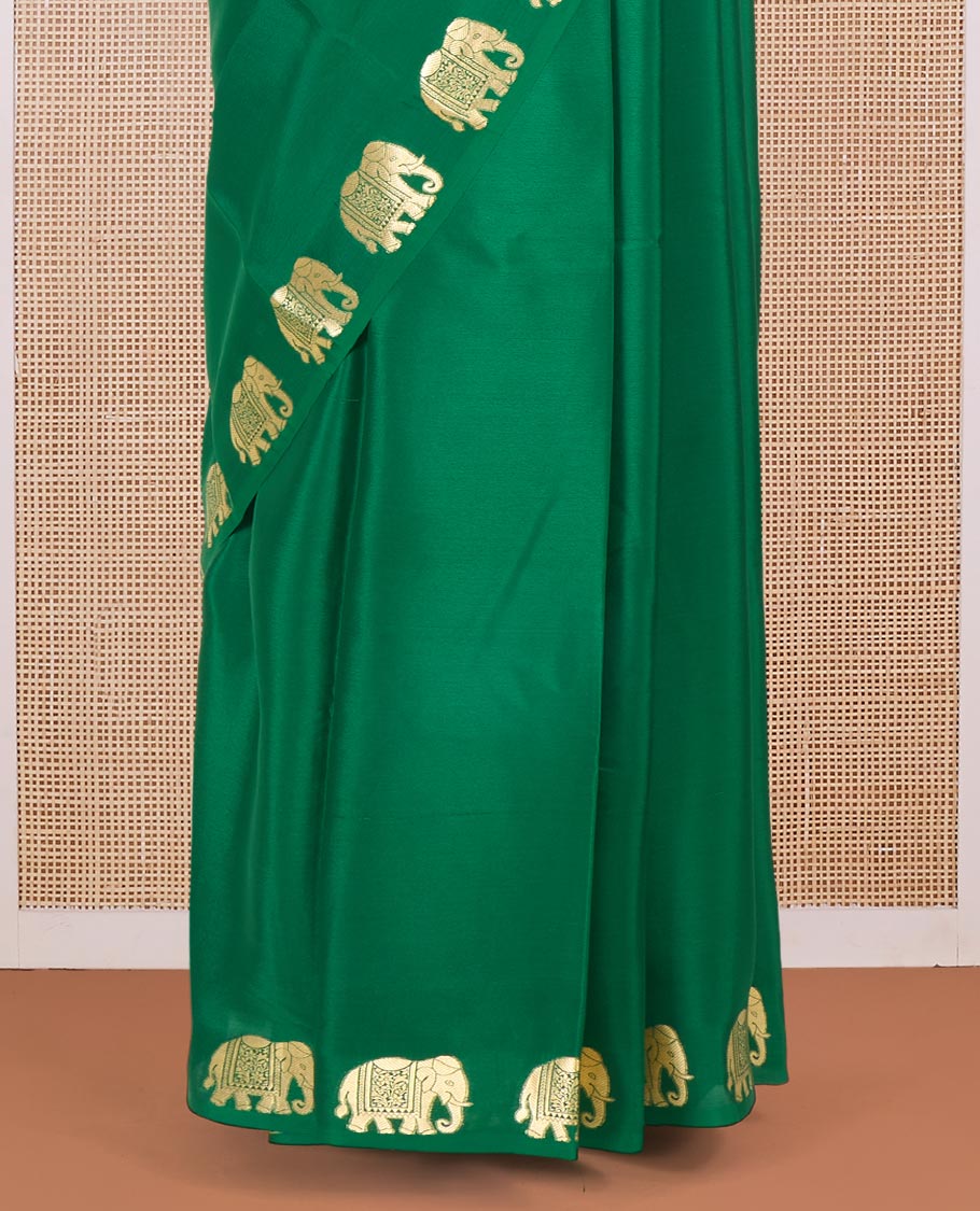 Green plain Mysore silk saree with elephant motifs zari border, and pallu of miniatures of elephant motifs