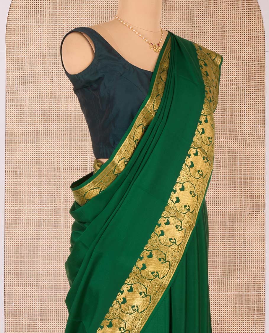 Green plain Mysore silk saree, two-headed eagle motifs zari woven border, and pallu steeped with two-headed eagle motifs