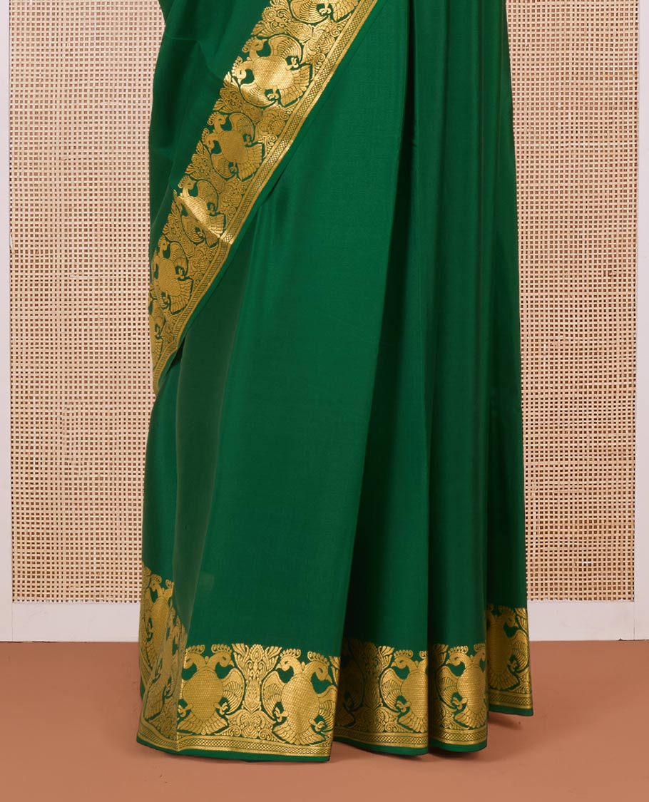 Green plain Mysore silk saree, two-headed eagle motifs zari woven border, and pallu steeped with two-headed eagle motifs