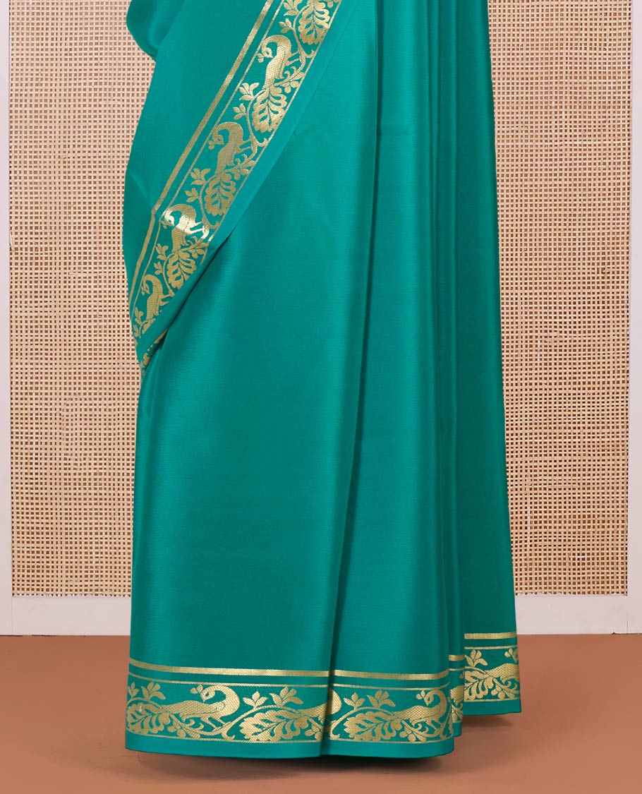 Green plain Mysore silk saree, peacock motifs zari border l, and zari striped pallu