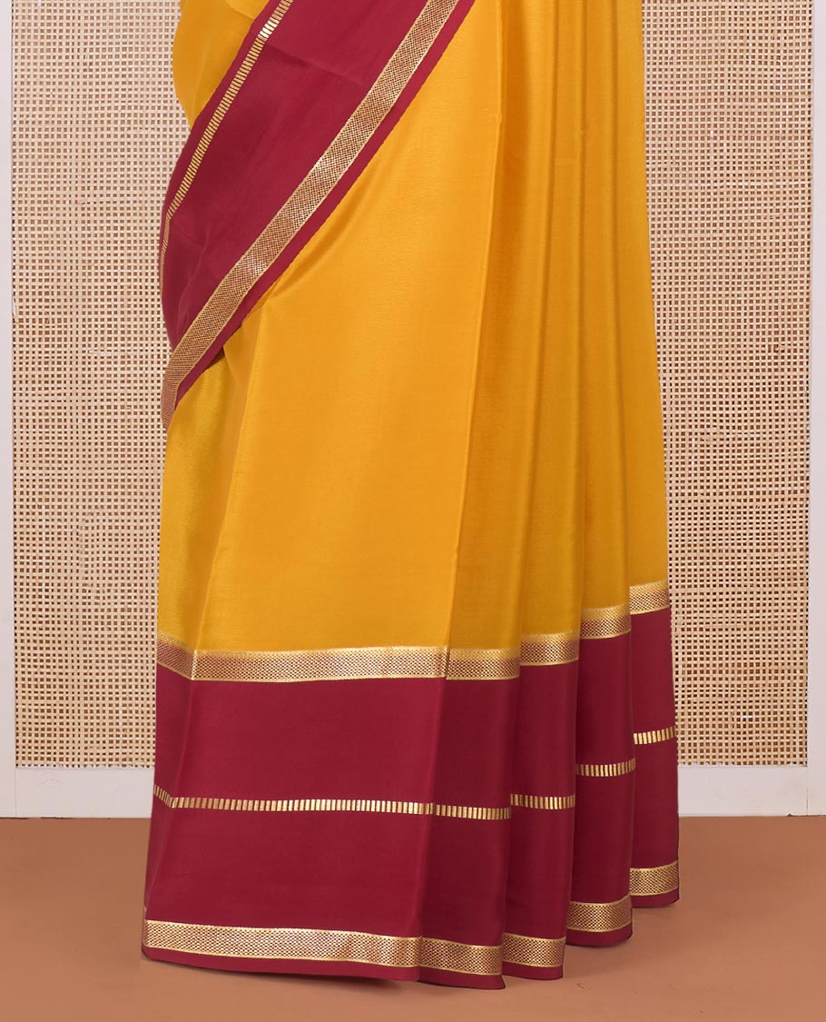 Yellow plain Mysore silk saree, contrast traditional zari border and pallu of zari designs