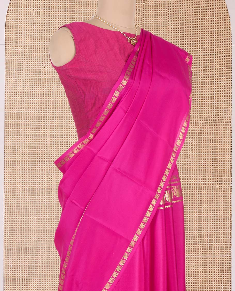 Pink plain Mysore silk saree, traditional zari border of elephant motifs, and zari striped pallu