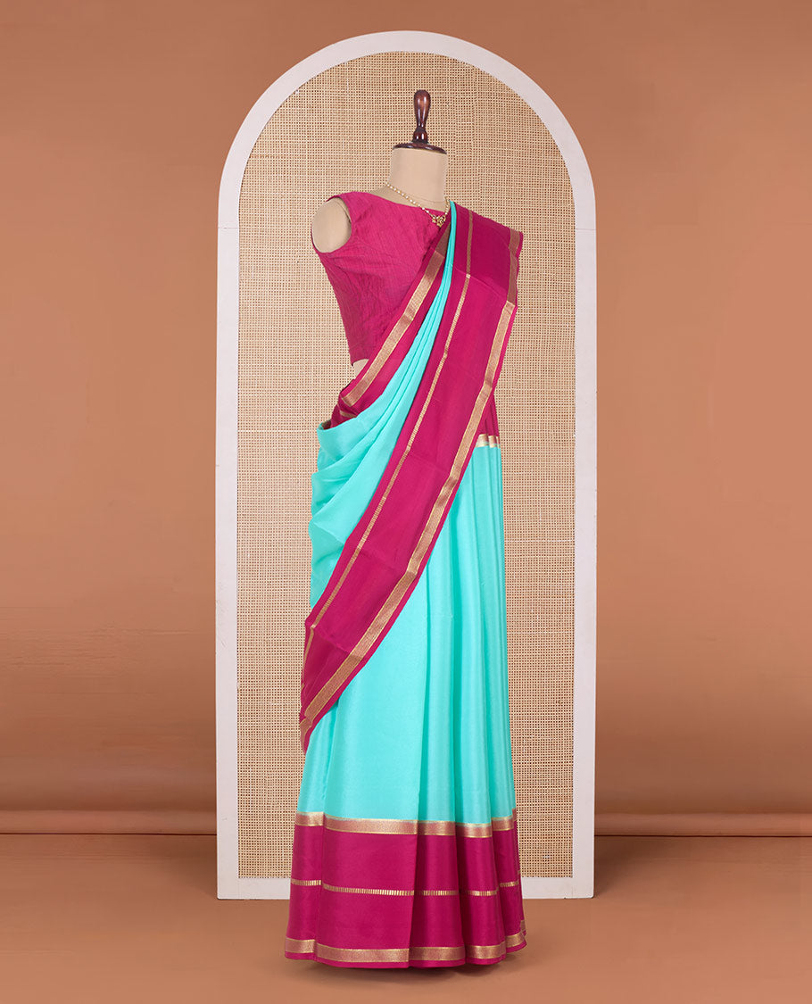 Turquoise plain Mysore silk saree, contrast traditional zari border, and zari-rich pallu