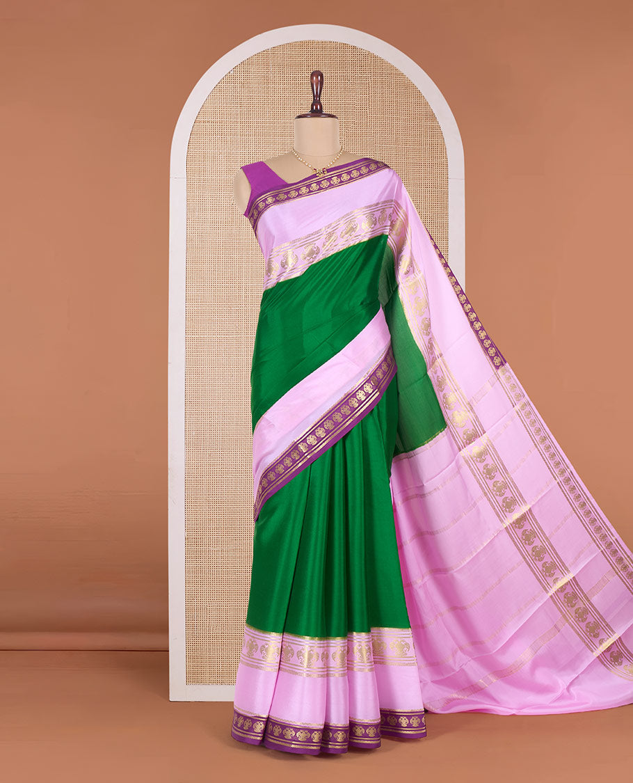 Green plain Mysore silk saree, contrast traditional zari border, and pallu of zari stripes
