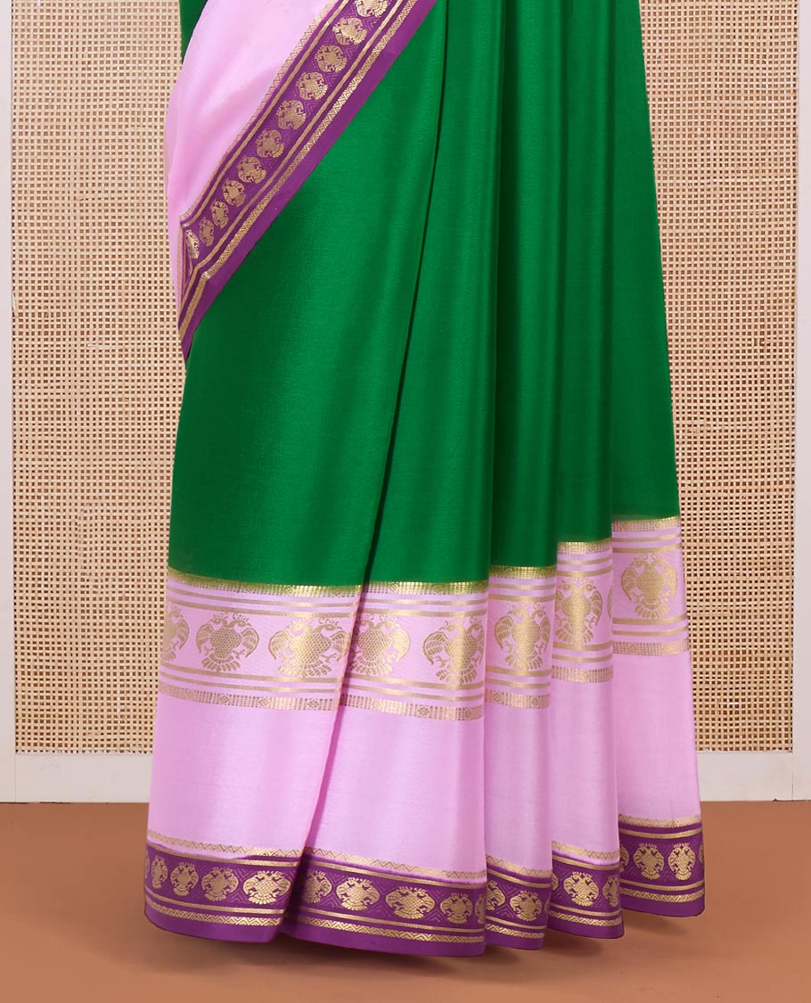 Green plain Mysore silk saree, contrast traditional zari border, and pallu of zari stripes