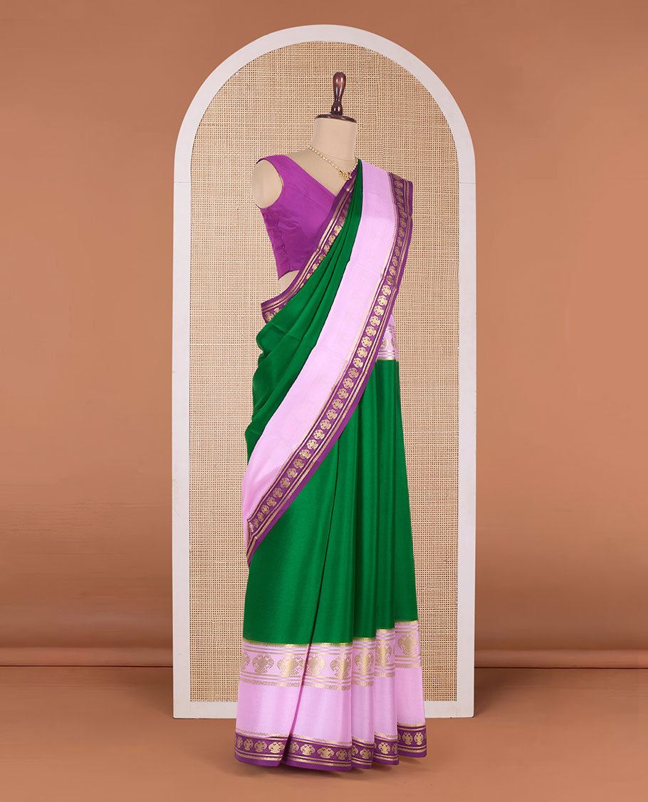 Green plain Mysore silk saree, contrast traditional zari border, and pallu of zari stripes