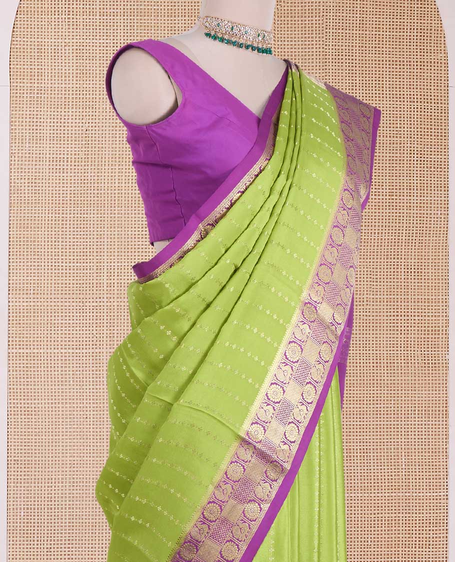 Parrot green zari design Mysore silk saree, contrast peacock chakra motifs border, and traditional zari design woven pallu