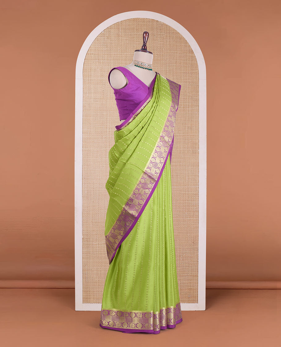 Parrot green zari design Mysore silk saree, contrast peacock chakra motifs border, and traditional zari design woven pallu