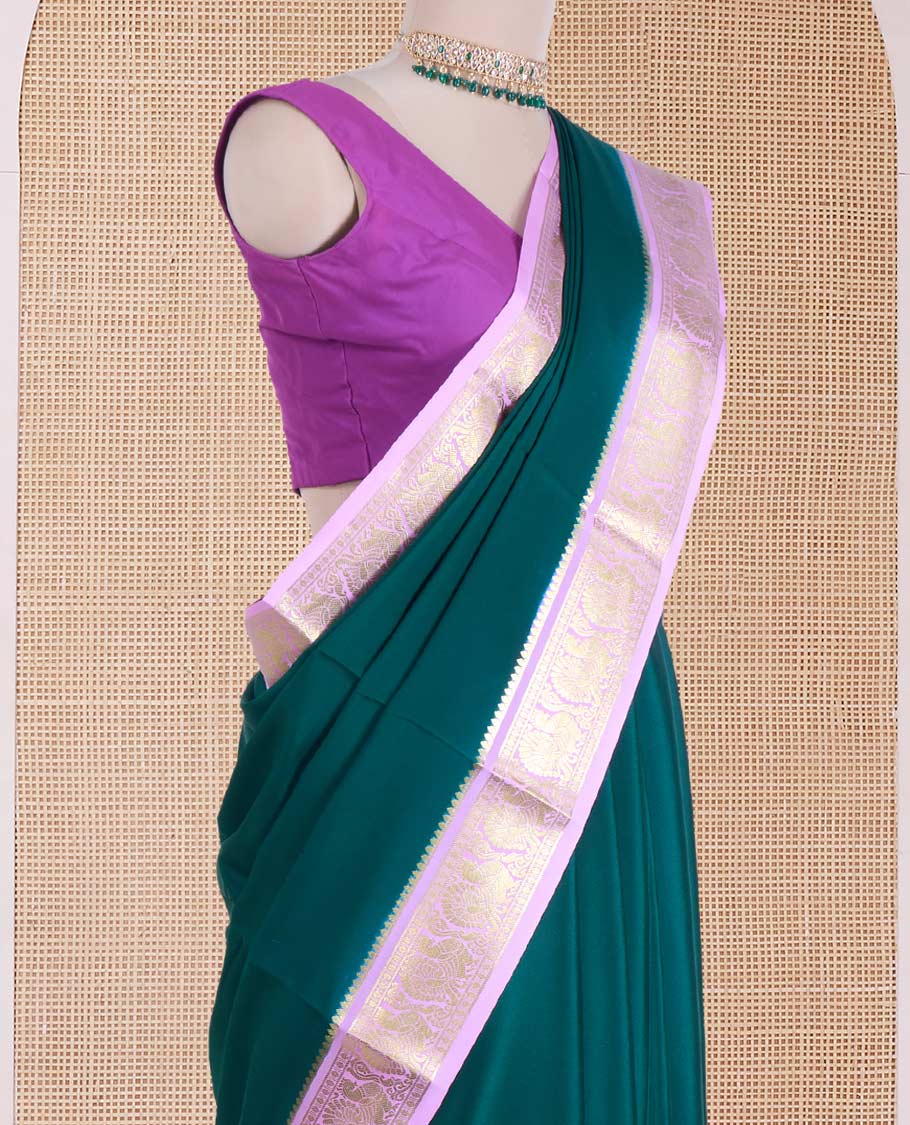 Dark green plain Mysore silk saree, contrast traditional zari border of peacocks, and zari design pallu