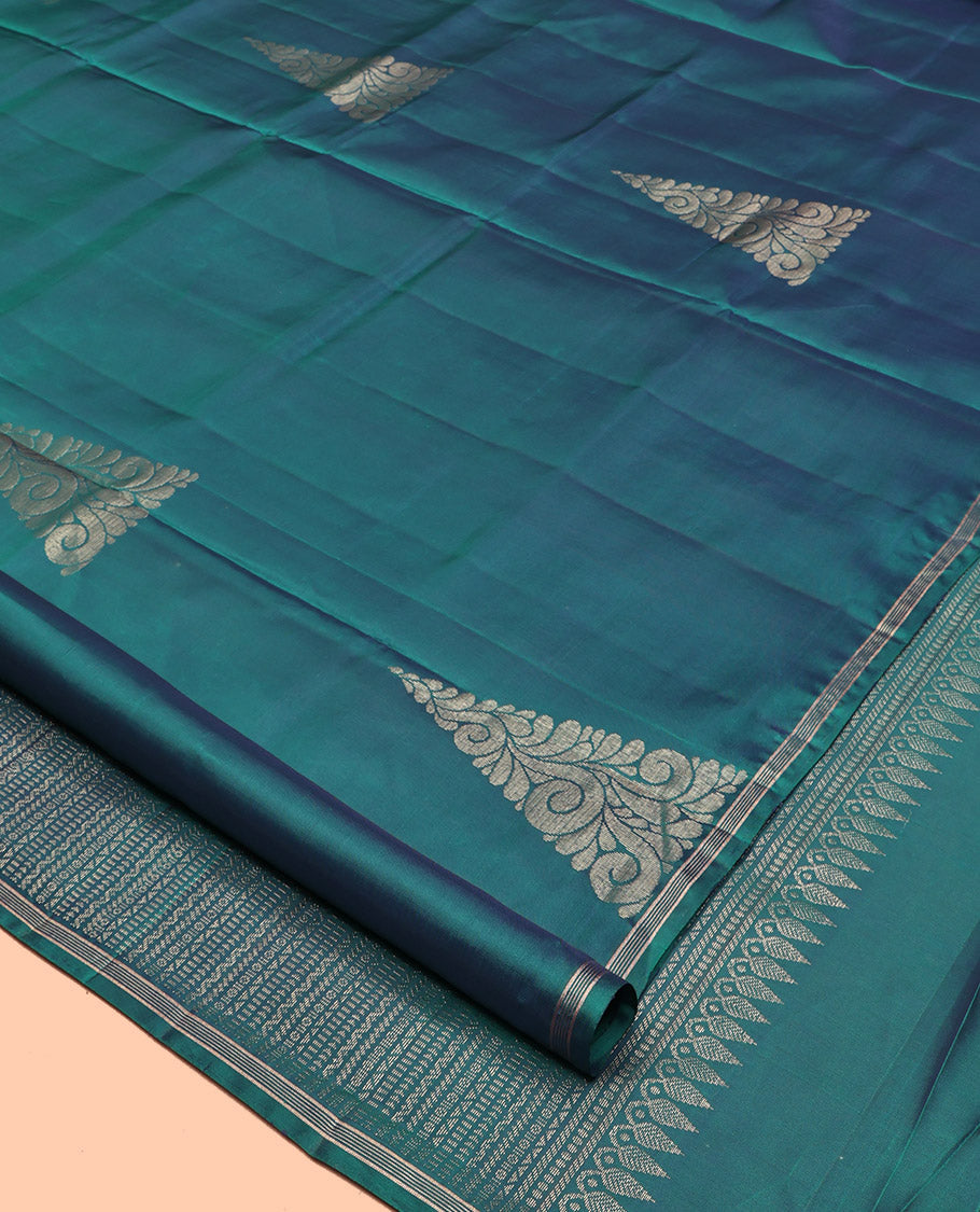 Peacock Blue Mayuri Lite Silk Mix Saree, Highlighted by Zari Buttas, a Subtle Piping Border, Pallu Steeped with Geometric Designs, and a Matching Blouse
