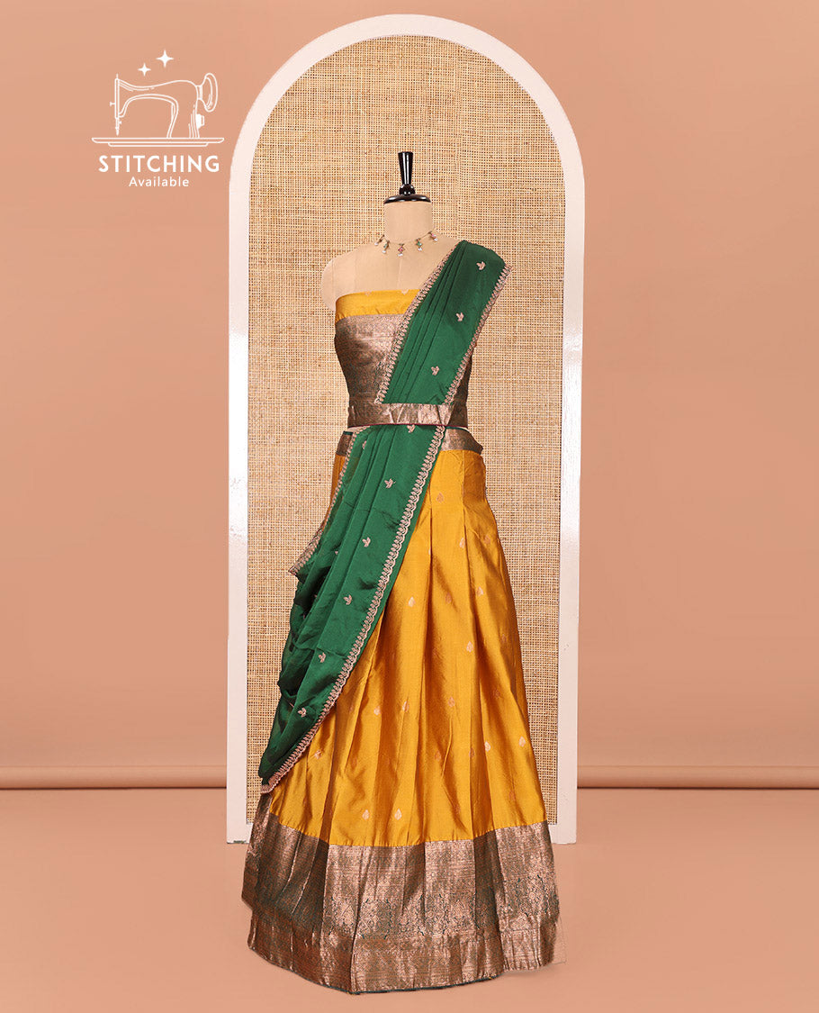 Yellow and Green Semi-Banarasi Half-Saree Beautified with Zari Buttas on Its Skirt, Complemented by a Contrast Traditional Zari Design Steeped Border, Paired with a Matching Blouse, and a Satin Georgette Embroidered Scallop Dhavani