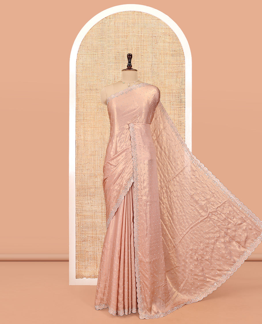 Rose Gold Designer Saree, Gleamed up with Stone Struck All Over Its Body, Scallop Stone Embroidered Border, and Heavy Embroidered Matching Blouse