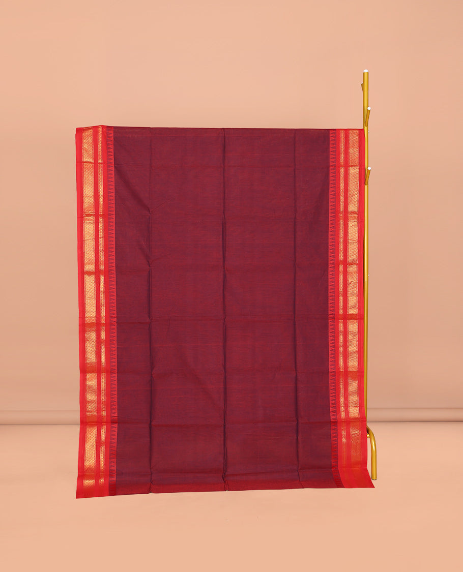 Maroon Plain Chettinad Cotton Saree, Complemented by a Contrast Traditional Zari Design Temple Border, Pallu of Stripes and Buttas, and Paired with a Matching Blouse