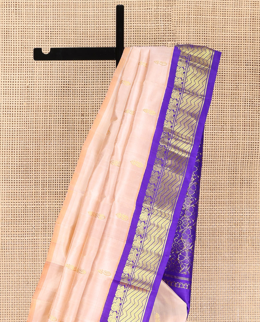 Light Sandal Kanchipuram Silk Saree, Delicately Woven with Zari Buttas on Its Body, Complemented by a Contrast One-Sided Korvai Border of Mayil, and Chevron Designs, Pallu of Floral Jaal Designs, and Comes Without a Blouse
