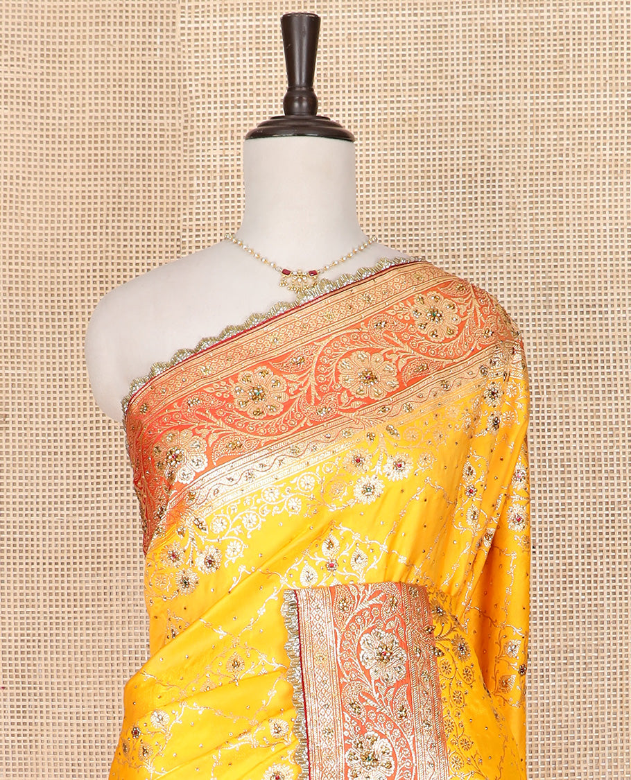 Yellow Art Vastrakala Silk Saree Mesmerized with Meenakari Jacquard with Stone Work All Over Its Body, Complemented by a Contrast Floral Creeper Zari Stone Work Lace Border, Pallu Detailed in Zari and Stone Work, and Paired with a Contrast Blouse
