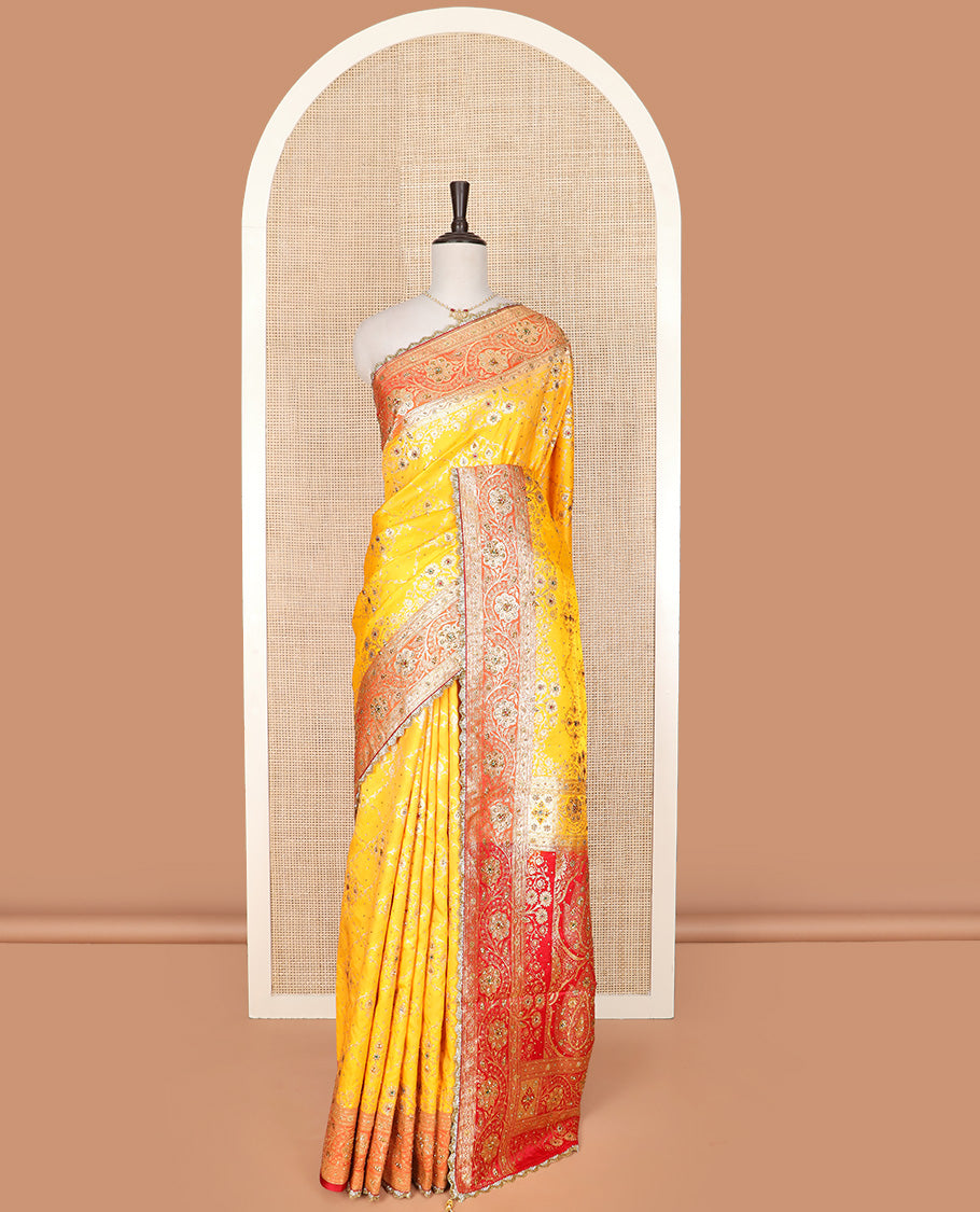 Yellow Art Vastrakala Silk Saree Mesmerized with Meenakari Jacquard with Stone Work All Over Its Body, Complemented by a Contrast Floral Creeper Zari Stone Work Lace Border, Pallu Detailed in Zari and Stone Work, and Paired with a Contrast Blouse
