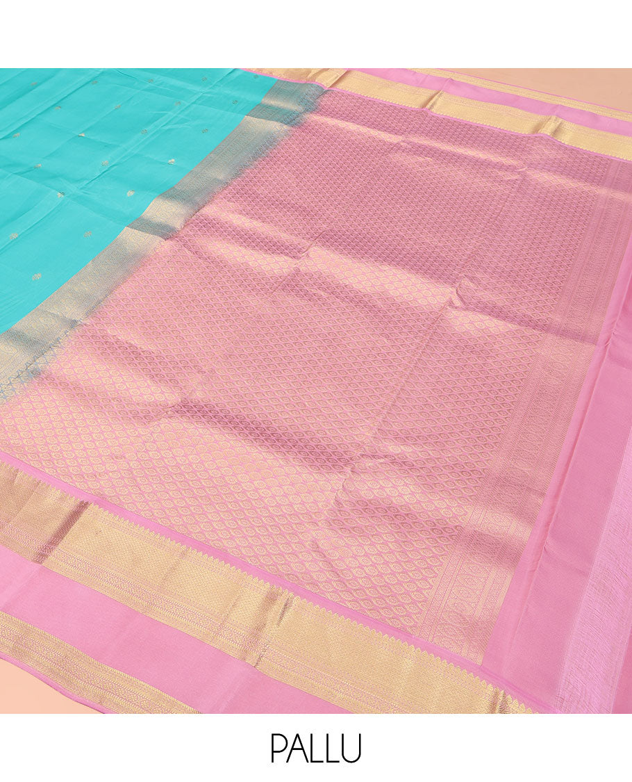 Blue Vasundhara Lite Silk Mix Saree, Adorned with Zari Buttas on Its Body, Complemented by a Contrast Retti Pettu Border of Thilakam, Banaras, Mayil Kann, Muthu, and Kamalam Designs, Pallu Steeped with Feather Motifs, and Paired with a Contrast Blouse