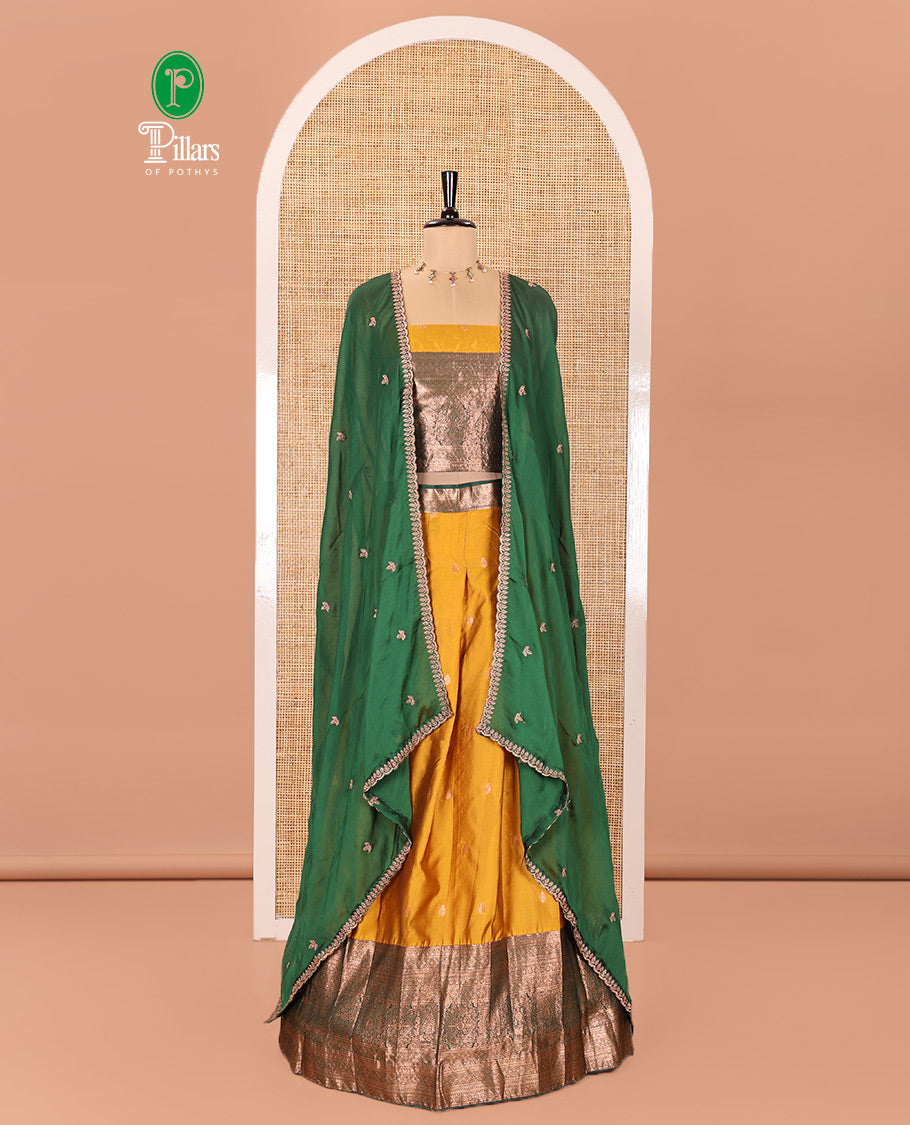 Yellow and Green Semi-Banarasi Half-Saree Beautified with Zari Buttas on Its Skirt, Complemented by a Contrast Traditional Zari Design Steeped Border, Paired with a Matching Blouse, and a Satin Georgette Embroidered Scallop Dhavani