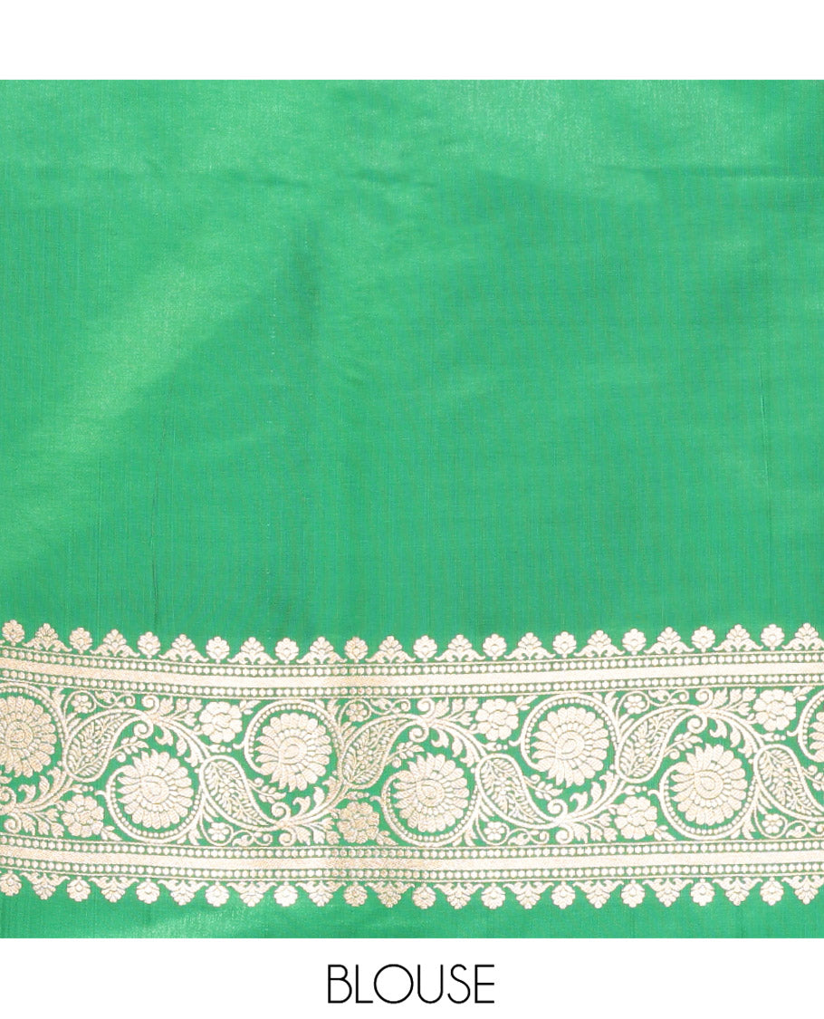 Red Semi-Banaras Saree, Richly Detailed with Zari Buttas on Its Body, Complemented by a Contrast Floral -Paisley Creeper Design Border, Intricately Designed Pallu, and Paired with a Contrast Blouse