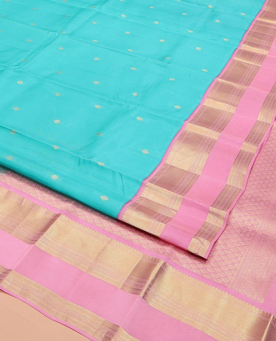 Blue Vasundhara Lite Silk Mix Saree, Adorned with Zari Buttas on Its Body, Complemented by a Contrast Retti Pettu Border of Thilakam, Banaras, Mayil Kann, Muthu, and Kamalam Designs, Pallu Steeped with Feather Motifs, and Paired with a Contrast Blouse