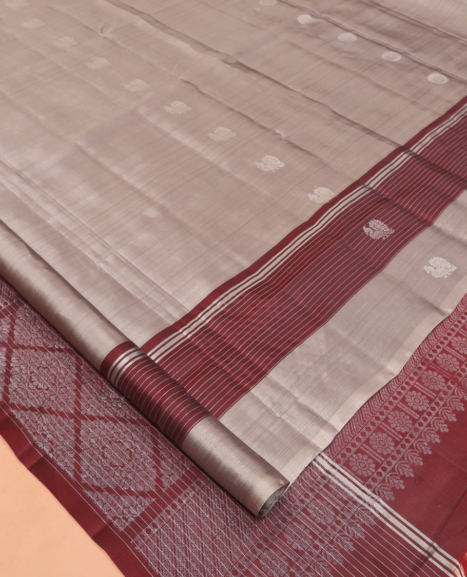 Grey Mayuri Lite Silk Mix Saree, Graced with Mayil and Chakram Zari Buttas, Complemented By Contrast Striped Border of Mayil Design, a Grand Jaal Pallu, and a Contrast Blouse