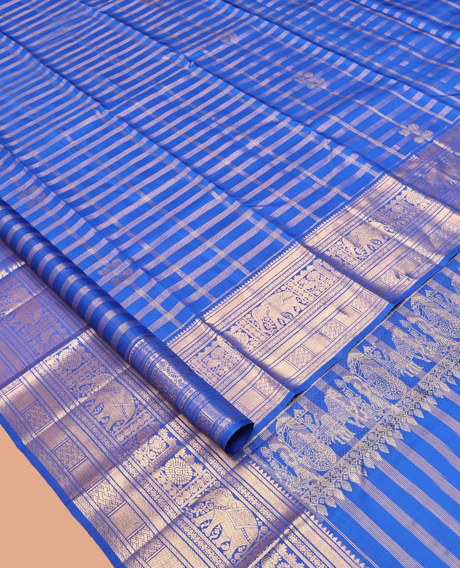 Blue Kanchipuram Silk Saree, Adorned with Zari Buttas and Checks, a Zari Border of Rekku, Kathir, Muthu, Rudraksham, Rekku, Yaanai, Chakram, and Paiyaddi Kattam, Jaal Pallu, Matching Blouse