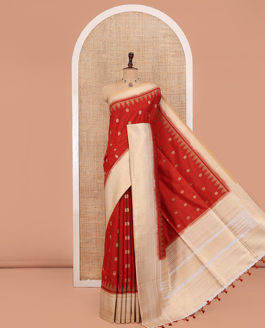 Rust Dupion Silk Saree, Decked Up with Zari Buttas All Over Its Body, Complemented by a Contrast Temple Traditional Zari Design Woven Border, Traditional Pallu of Temple Designs, and Paired with a Contrast Blouse