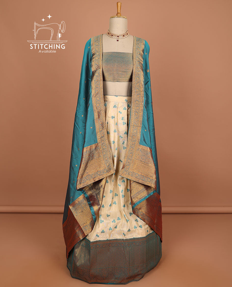 Cream floral buttas half saree with contrast zari border, zari design blouse & blue floral zari design dhavani